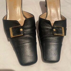 Chic Black Leather Mules with Gold Buckle chanel vintage